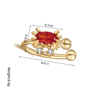 Detailed view of gold crab ear cuff with red stone and dimensions showing 0.7cm width