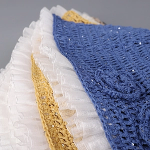 Close-up of crochet sun hat with sequins and pleated chiffon edge detailing