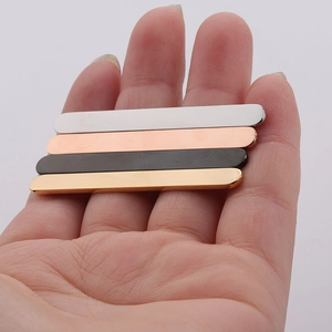 Detailed close-up of 5mm polished stainless steel flat metal strips in four varied colors