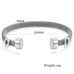 Detailed view of a 6mm silver mesh cable bangle featuring D and O letter charms