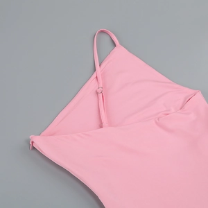 Detail of adjustable thin straps and invisible zipper on a pink slim summer dress
