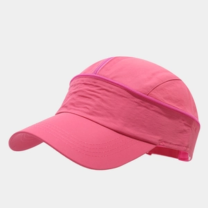 Detail view of the side zipper on a rose pink quick-dry sports cap for ponytail options