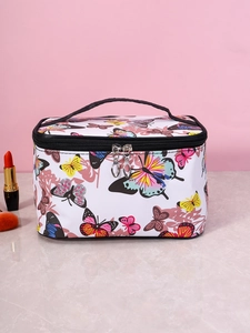 Detail of floral butterfly print on square cosmetic bag with black handle and zipper