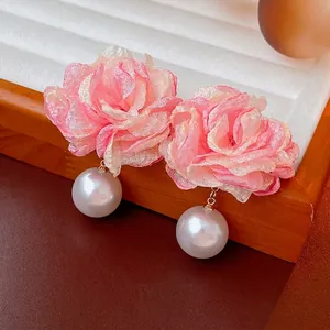 Elegant pink fabric flower earrings with pearls on silver needles for women