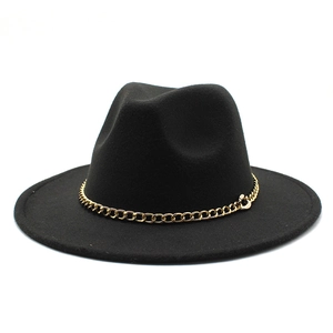 Detailed view of wide brim wool fedora hat featuring thick gold chain decoration