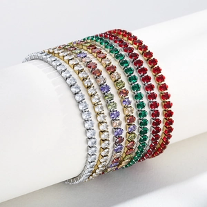 Elegant gold and silver tennis bracelets with colorful oval cubic zirconia stones