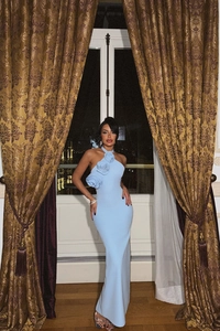 Detail of light blue halter neck dress with three 3D rose flowers and backless design