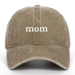 Detail of mom letter embroidery on khaki washed cotton baseball cap texture