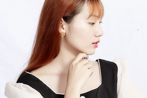 Detailed view of golden Tree of Life earrings with intricate hollow resin rhinestones