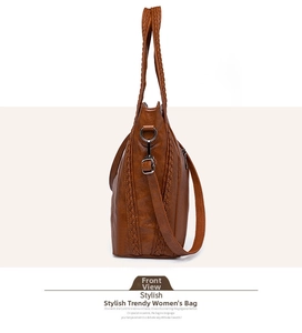 Side view of brown soft leather tote bag with woven texture and adjustable strap