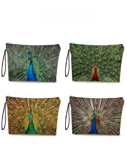 Pattern display of four peacock print makeup bags with zipper and wrist straps