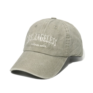 Close-up of white LOS ANGELES letter embroidery on gray washed canvas baseball cap