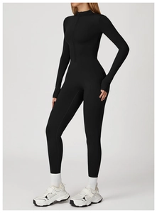 Detail view of black fitness jumpsuit featuring a stand collar zipper and thumbhole cuffs
