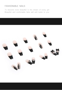 Detail of long coffin press-on nails with 3D black bows, white pearls and rhinestones