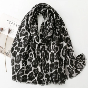 Leopard print cotton linen scarf with frayed edges for winter fashion in gray and black