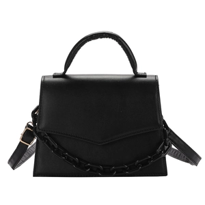 Minimalist black matte leather crossbody bag with top handle and chunky chain detail