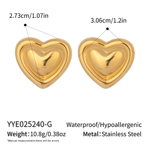 Detail view of gold heart earrings with size 2.73cm x 3.06cm and waterproof specs