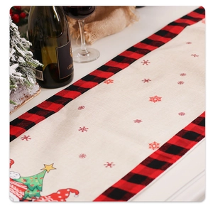 Linen Christmas table runner with snowflake patterns and forest gnome illustrations