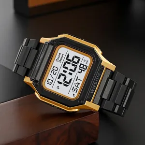 Digital sport watch in black and gold with waterproof LCD display on wood base