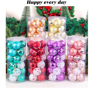 Detail of colorful assorted Christmas ball ornaments in clear cylindrical packaging