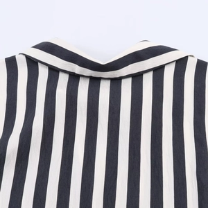 Close-up of lapel collar and sewing on black and white striped cotton-linen shirt