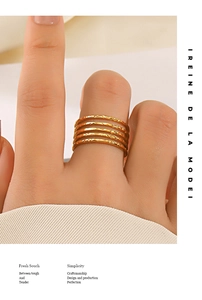 Detail of 18K gold plated multi-layer ring with textured hammered finish on model hand