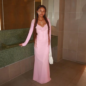Detail of pink long-sleeved ruffle dress with deep V-neck and soft chiffon fabric texture