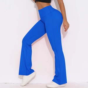 Detail of high-waist flared yoga pants in electric blue with tummy control seam