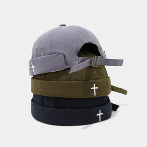 Detailed trio of miki hats in grey, olive, and navy with cross embroidery and metal strap