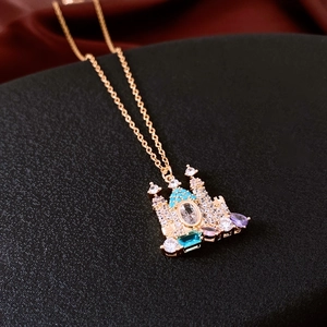 Detail of 18K gold plated castle pendant necklace featuring colorful zircon stones