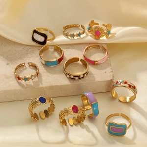Set of 11 retro 18k gold plated open rings with colorful enamel floral and star patterns