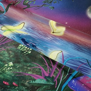 Close-up of fabric texture showing high-quality fantasy mushroom and butterfly print