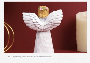 Detail view of angel resin ornament with intricate wood-grain texture and golden braids