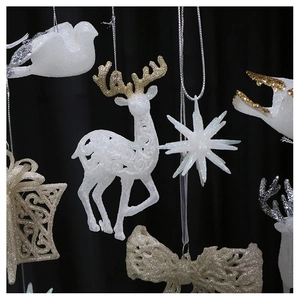 Detailed view of champagne silver glitter reindeer and star Christmas tree ornaments