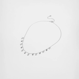 Macro detail of S925 silver necklace featuring pear-shaped cubic zirconia water drop pendants