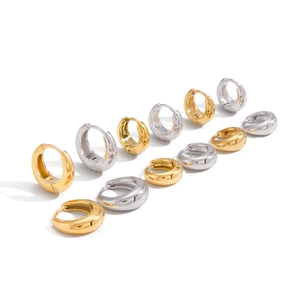 Set of 11 pairs of chunky gold and silver huggie hoop earrings in various sizes