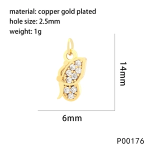Detail of a butterfly charm in copper gold plated with zircon inlays and measurements