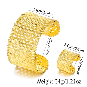 Detailed view of hollow gold cuff bracelet and ring set with leaf pattern and dimensions