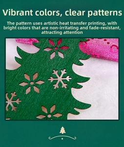 Detail of green wooden Christmas tree ornament with intricate hollow snowflake patterns