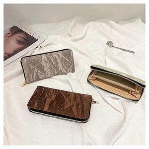 Detailed interior of long zipper wallet showing multiple card slots and large compartments