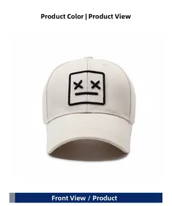 Close-up of black cartoon facial embroidery on beige cotton baseball cap with curved brim