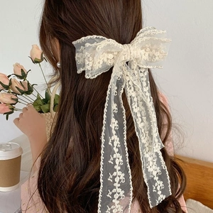Elegant off-white lace bow hair clip with long ribbons and floral embroidery for women