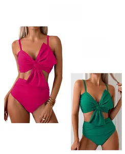 Detailed view of high-waist bikini set with large decorative bows in pink and green