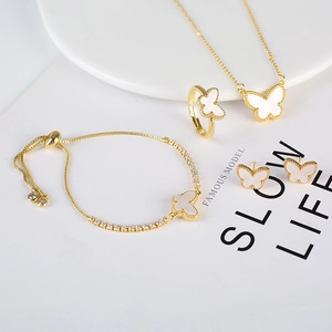 Elegant gold butterfly jewelry set including necklace, ring, bracelet and stud earrings