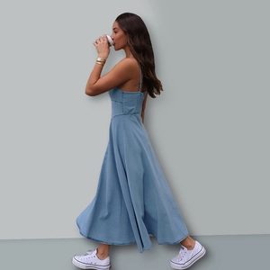 Detail of blue denim maxi dress showing the A-line silhouette and adjustable straps
