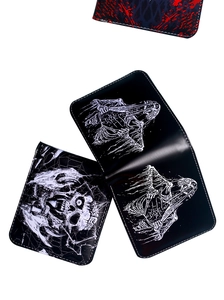 Close-up of black leather wallet with artistic skull prints and detailed inner compartment