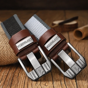 Classic canvas belt with vintage pin buckle and leather detail for casual jeans