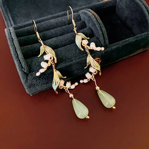 Elegant lily of the valley tassel earrings with green enamel leaves and pear-cut beads