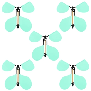 Group of five light green magic flying butterflies with elastic bands on white background