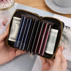 Black crocodile embossed zipper card holder with multiple organ-style slots and cash pockets